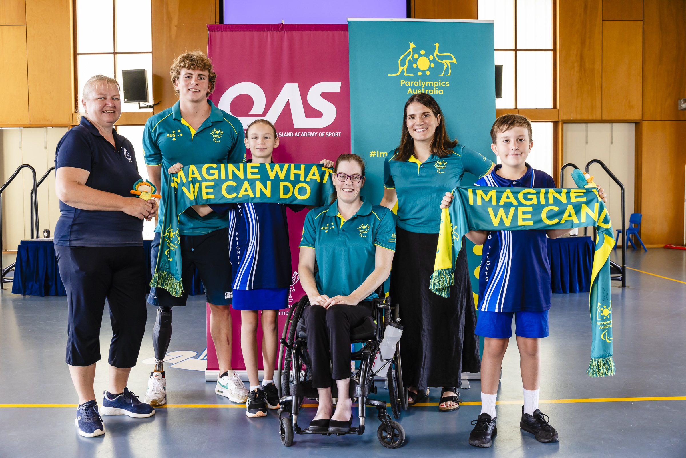 Paralympians gather with students and a teacher from Stafford Heights School to launch the Imagine Education program